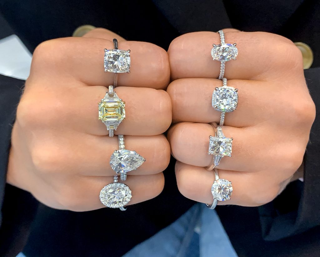 ladies hands multiple various style engagement rings diamond moissanite yellow