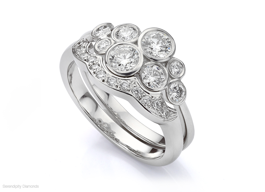 Shaped wedding ring fitting to a diamond bubble ring