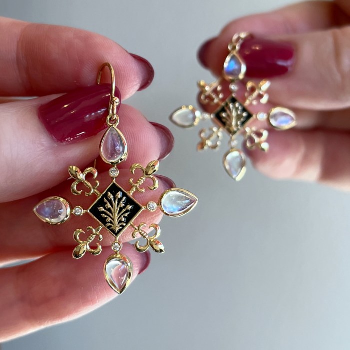 The Magdelena Fleur de Lis earrings from Loriann Jewelry's Modern Renaissance collection. Black enamel, diamond, and moonstone earrings in gold.