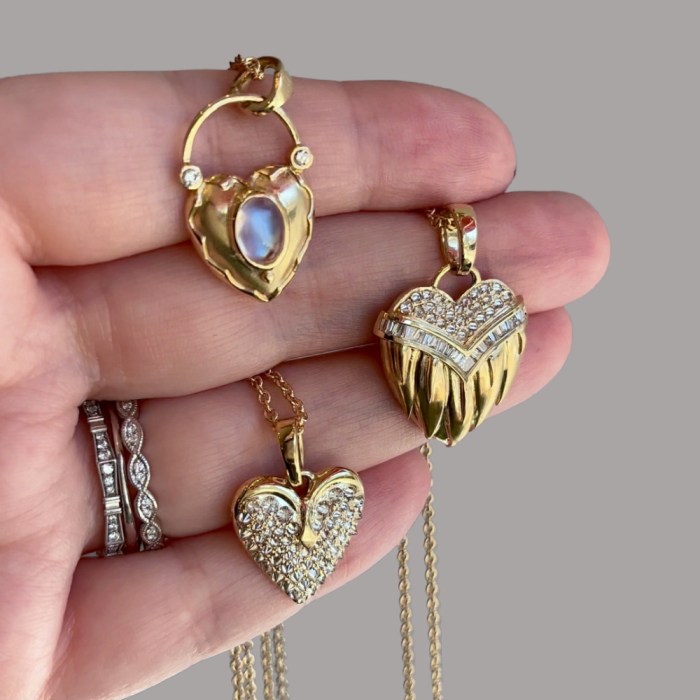 Three heart necklaces from Loriann Jewelry's Modern Renaissance collection. Yellow gold with diamonds and moonstone.
