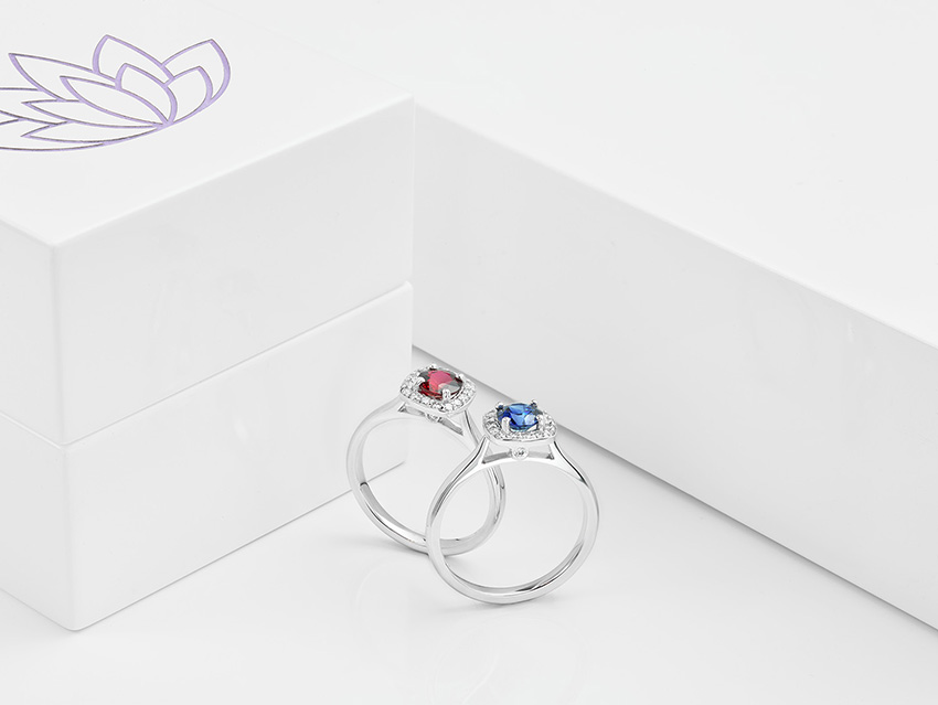 Ruby-and-sapphire-cushion-halo-pair-of-rings.jpg